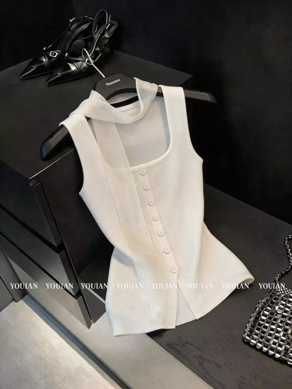 Chic French-style ice-silk knit camisole featuring a square neck and elegant ribbon halter straps—a stylish, sleeveless top perfect for summer wear.