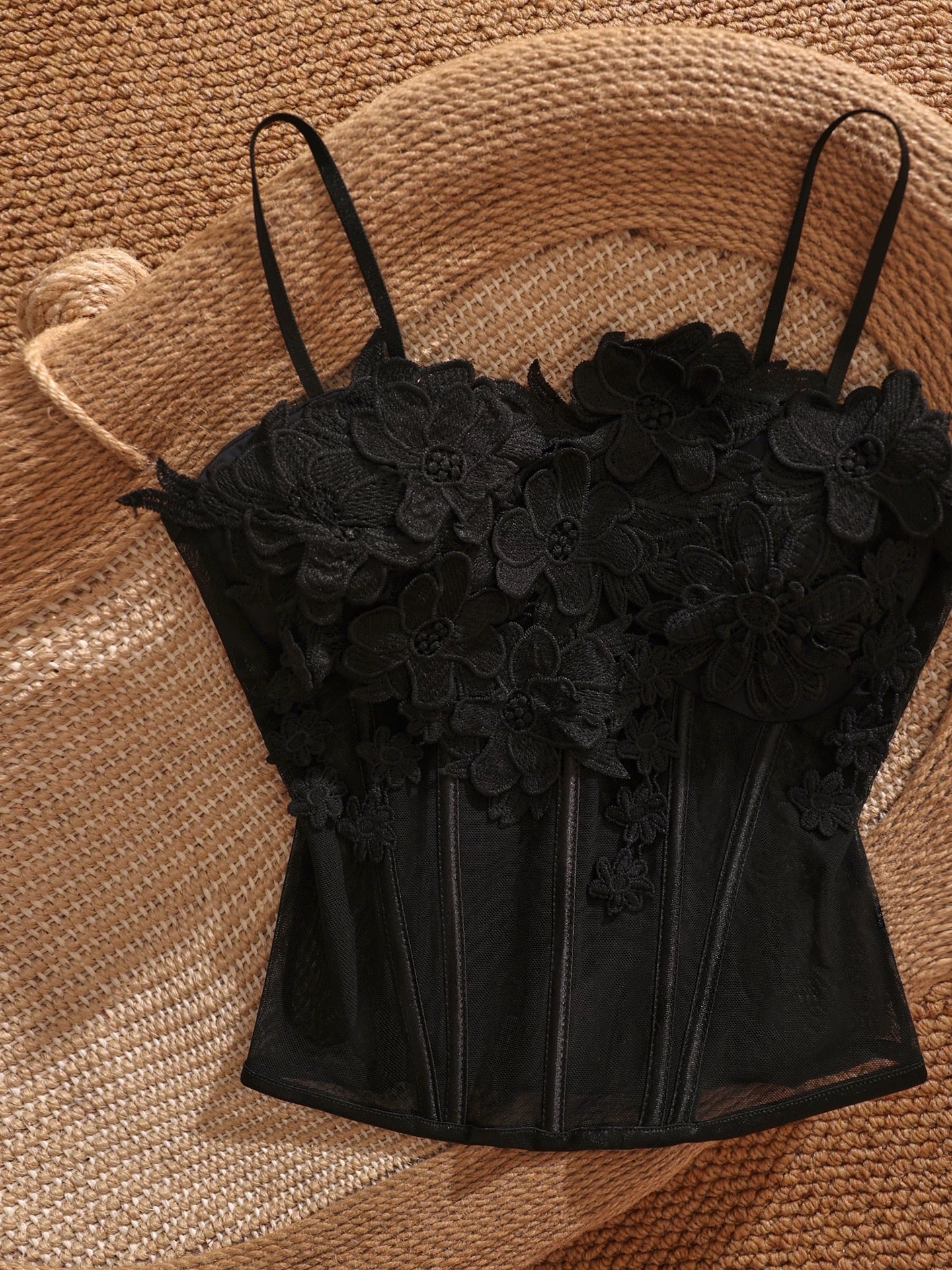 Black sexy 3D floral fishbone camisole top with bra padding, perfect for layering over a short, sexy, and alluring top.