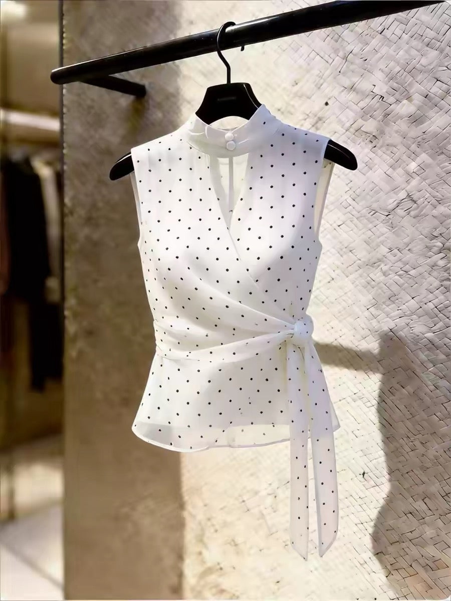 High-end, unique-design white sleeveless blouse for women featuring a polka-dot pattern, mandarin collar, tie-waist, and a slimming fit—perfect for summer.