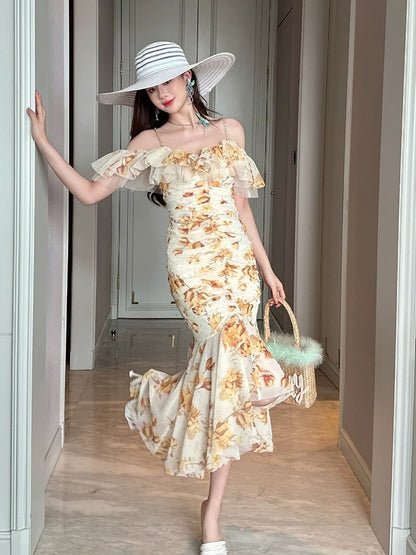 French ruffled sling one-shoulder yellow floral dress 2025 new summer irregular design chic long skirt