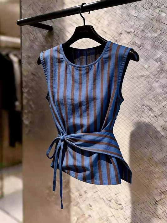 Stylish blue sleeveless top featuring vertical stripes, a self-tie waist, and a sophisticated, unique design—perfect as a chic summer layering piece.