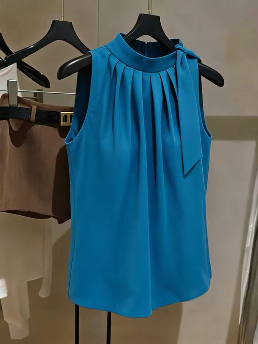 Chic French-style blue halter-neck chiffon top—a sophisticated, versatile, and pleated sleeveless blouse for women.