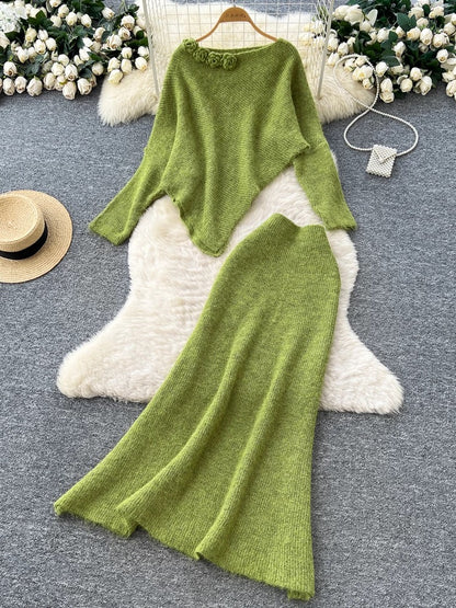 Gentle and elegant women's autumn and winter outfit: loose-fitting, irregularly shaped sweater with three-dimensional floral pattern and high-waisted knitted skirt.