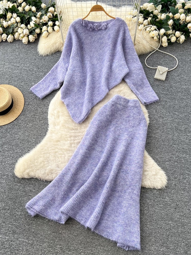 Gentle and elegant women's autumn and winter outfit: loose-fitting, irregularly shaped sweater with three-dimensional floral pattern and high-waisted knitted skirt.