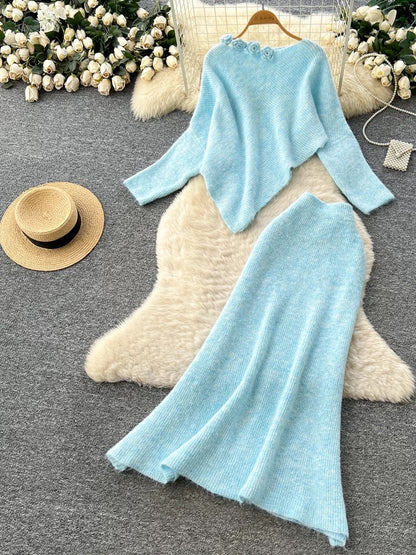 Gentle and elegant women's autumn and winter outfit: loose-fitting, irregularly shaped sweater with three-dimensional floral pattern and high-waisted knitted skirt.