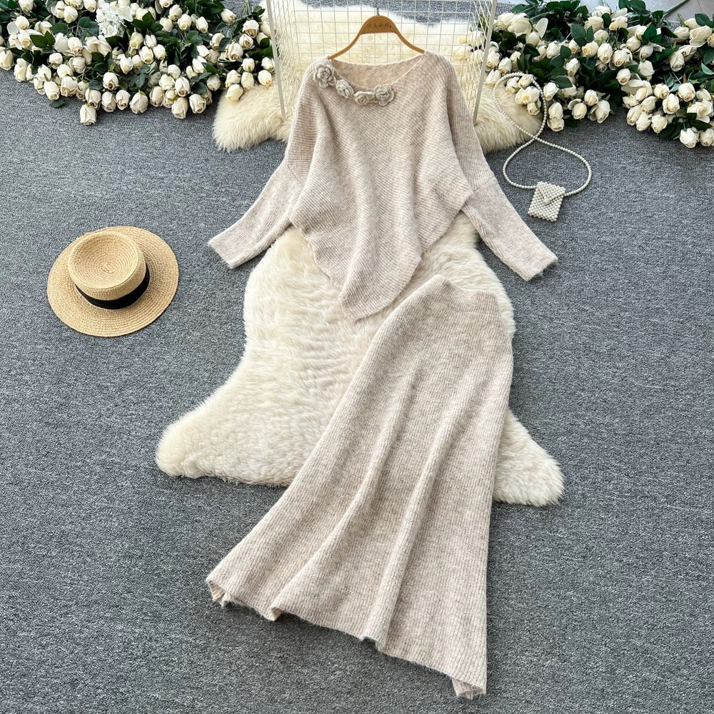 Gentle and elegant women's autumn and winter outfit: loose-fitting, irregularly shaped sweater with three-dimensional floral pattern and high-waisted knitted skirt.