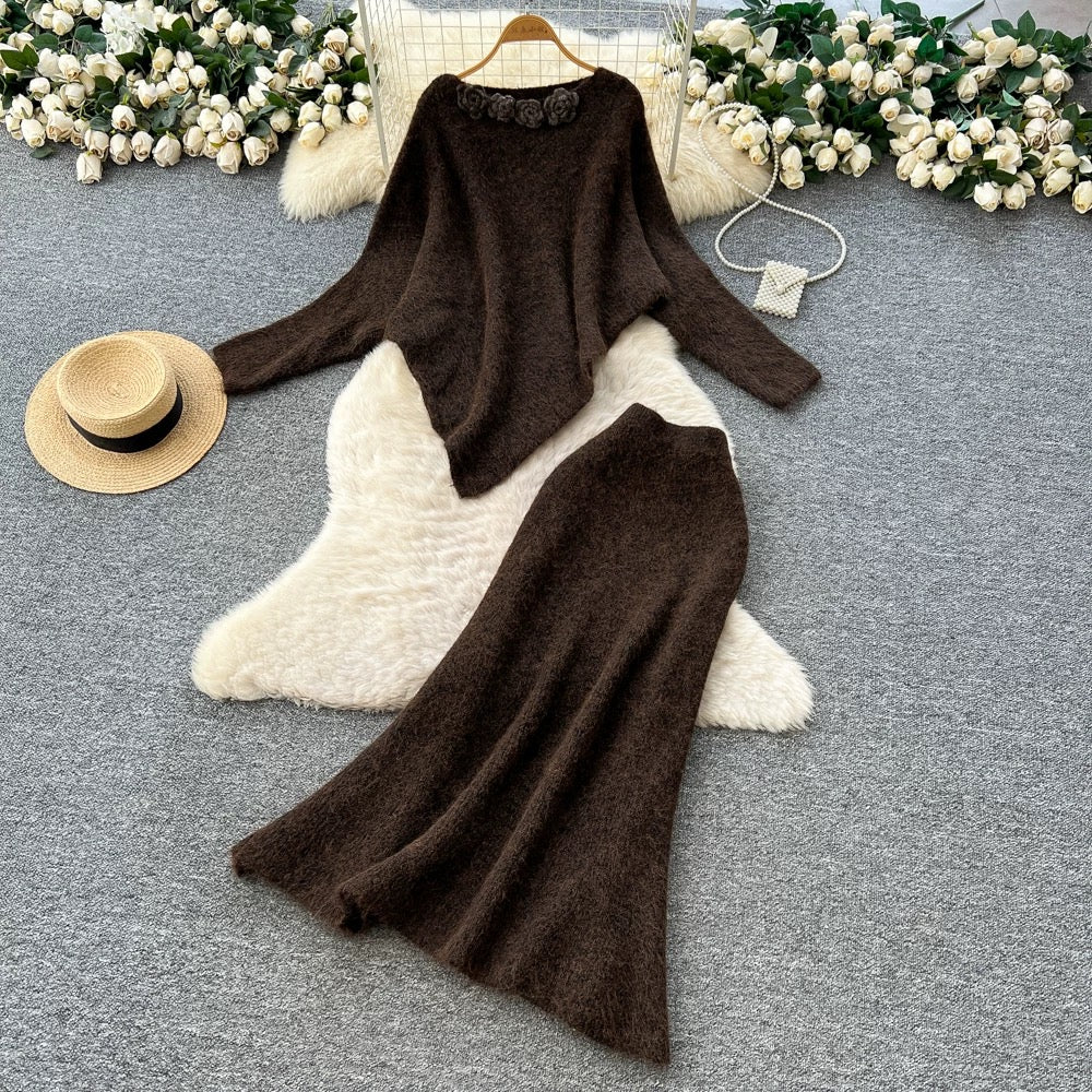 Gentle and elegant women's autumn and winter outfit: loose-fitting, irregularly shaped sweater with three-dimensional floral pattern and high-waisted knitted skirt.