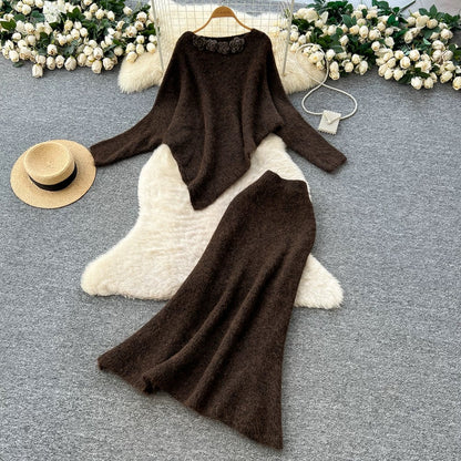 Gentle and elegant women's autumn and winter outfit: loose-fitting, irregularly shaped sweater with three-dimensional floral pattern and high-waisted knitted skirt.