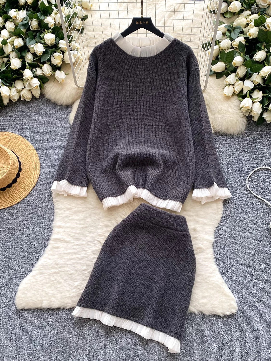 Gentle and elegant style for women's autumn and winter: long-sleeved loose knit top with ruffled trim and high-waisted bodycon skirt.