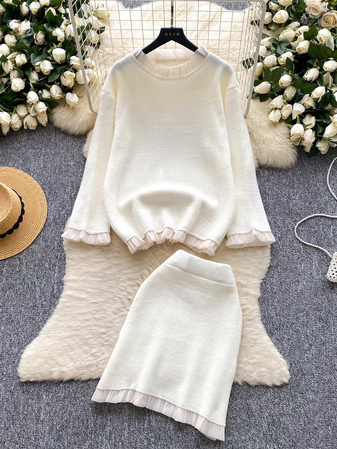 Gentle and elegant style for women's autumn and winter: long-sleeved loose knit top with ruffled trim and high-waisted bodycon skirt.