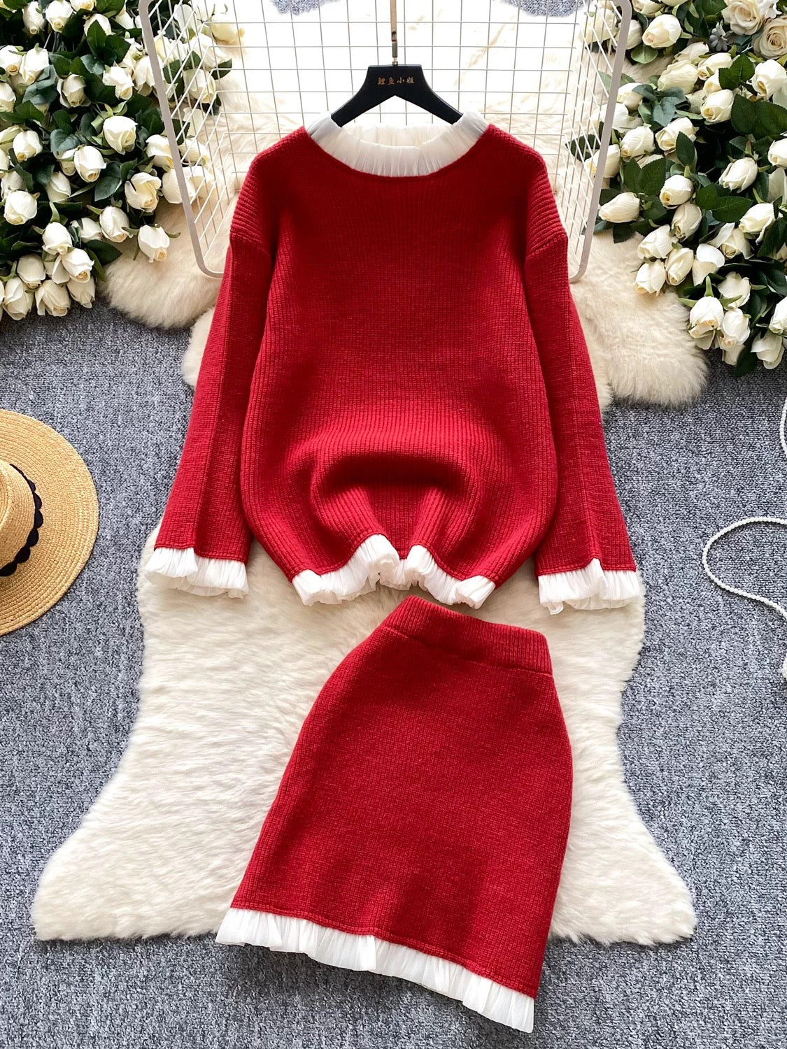Gentle and elegant style for women's autumn and winter: long-sleeved loose knit top with ruffled trim and high-waisted bodycon skirt.