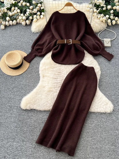 A sophisticated two-piece women's fashion set featuring a tie-waist, batwing sleeve knit top and a high-waisted pencil skirt.
