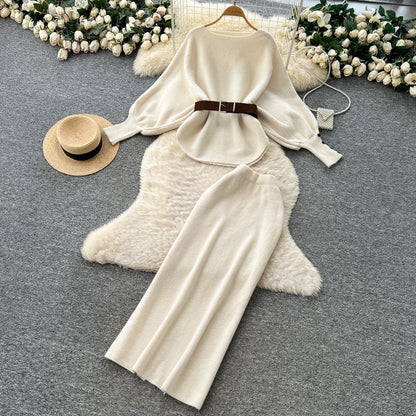 A sophisticated two-piece women's fashion set featuring a tie-waist, batwing sleeve knit top and a high-waisted pencil skirt.