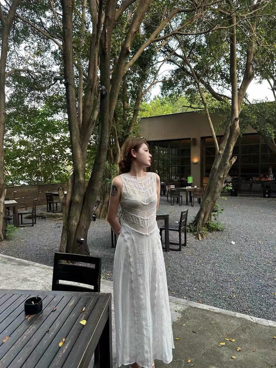 "Louvre Dreamscape" French vintage-style sleeveless maxi dress featuring a fitted waist and intricate, heavy-weight blended lace with cut-out detailing.
