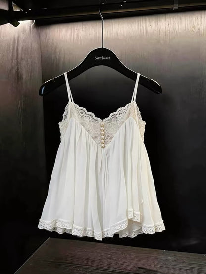 A stunning, stylish, and chic white camisole for women—perfect for summer workwear or casual outings. Featuring a flattering, slim-fit silhouette and exquisite lace paneling, this unique top blends fashion-forward design with effortless elegance.