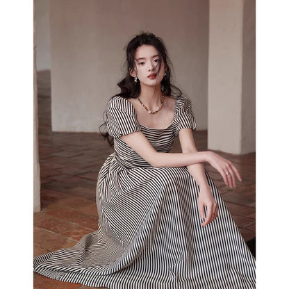 Meizi's same style [slightly drunken lines] black and white striped suspender dress design holiday style puff sleeve long skirt