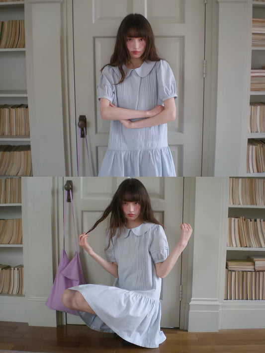 RAINY Sweet Preppy-Style Solid-Color Dress: Featuring a Peter Pan collar, puff sleeves, and a pleated panel skirt—a youthful, short-length design.