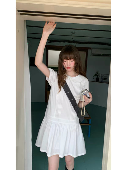 RAINY Sweet Preppy-Style Solid-Color Dress: Featuring a Peter Pan collar, puff sleeves, and a pleated panel skirt—a youthful, short-length design.