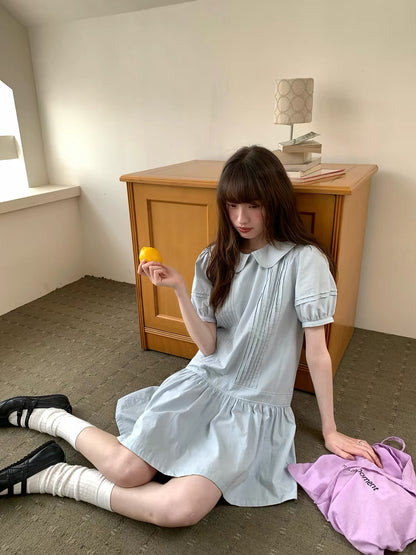 RAINY Sweet Preppy-Style Solid-Color Dress: Featuring a Peter Pan collar, puff sleeves, and a pleated panel skirt—a youthful, short-length design.