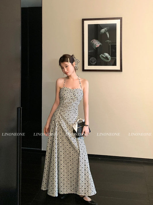 LINONEONE French-style textured black and white checkered halter-neck floral dress with a fitted waist and romantic skirt.