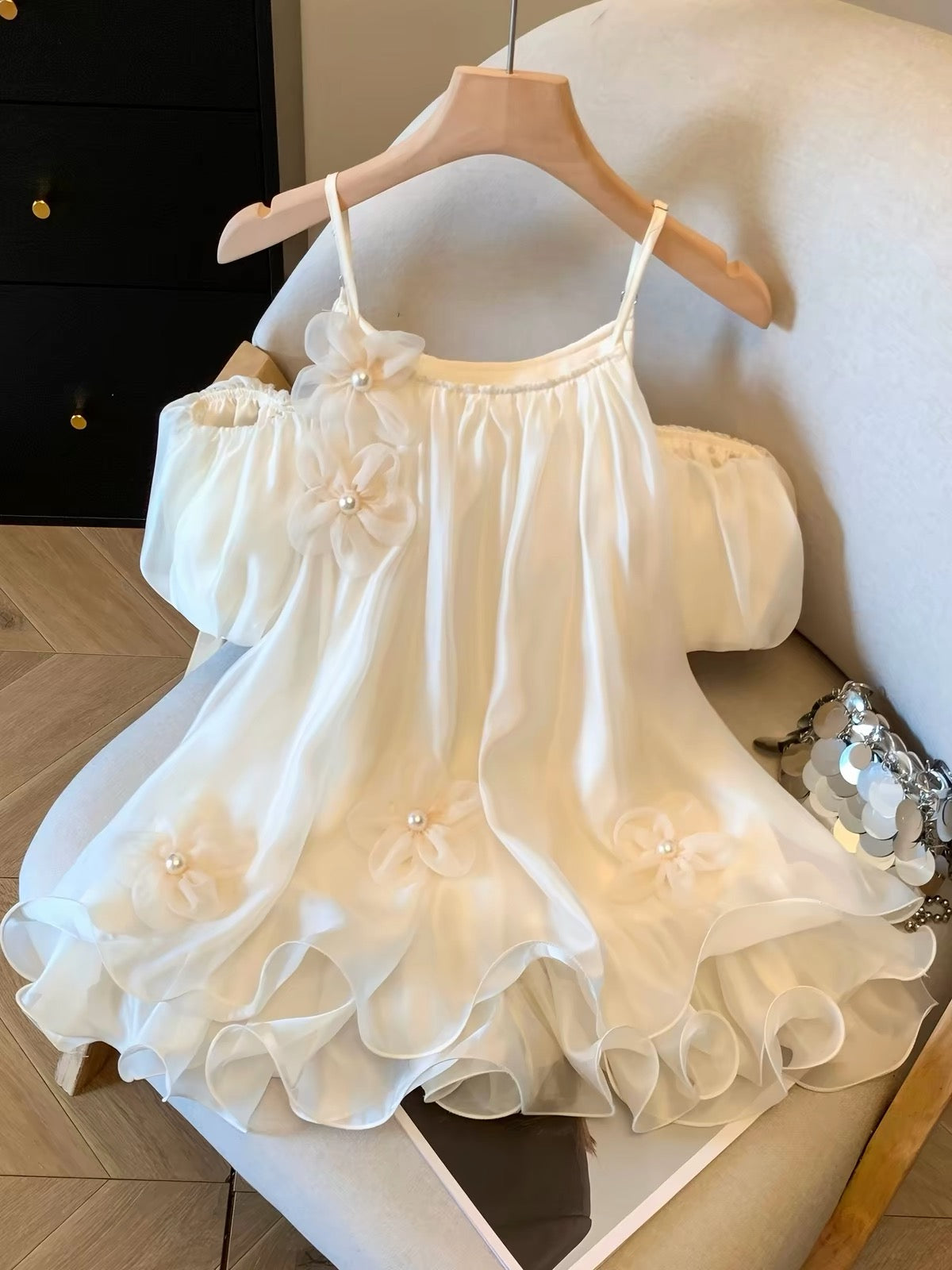 Women's summer off-shoulder chiffon camisole—a chic, youthful, and ethereal top featuring 3D floral details that blends a soft, innocent allure with a touch of sexiness