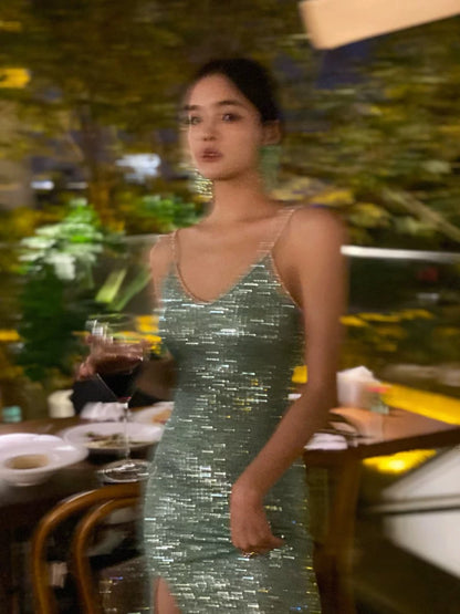 A sophisticated green sequined evening gown, a figure-hugging, sexy shimmering slip dress, perfect for a birthday party or small gift.
