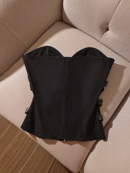 Punk-style black strapless corset top with studs, leather buckle, and lace-up details—a sexy and cool top with a sophisticated, mature vibe.
