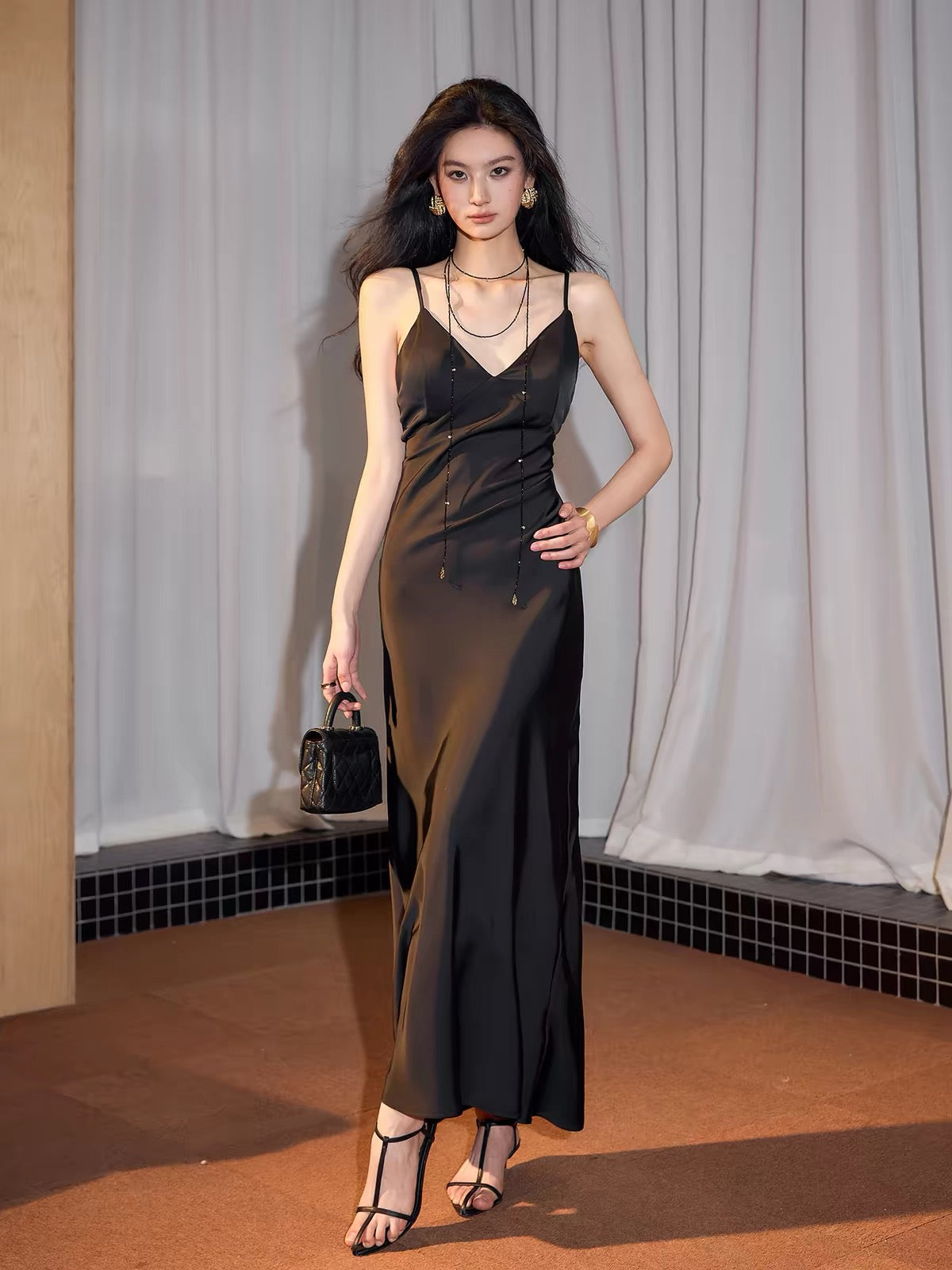 Exquisitely Tailored: A Sophisticated, Sexy, and Elegant Backless Satin Maxi Dress with a French-Style V-Neck and Beautiful Drape.