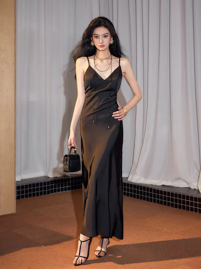 Exquisitely Tailored: A Sophisticated, Sexy, and Elegant Backless Satin Maxi Dress with a French-Style V-Neck and Beautiful Drape.