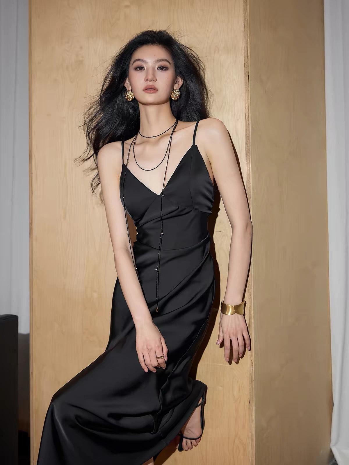 Exquisitely Tailored: A Sophisticated, Sexy, and Elegant Backless Satin Maxi Dress with a French-Style V-Neck and Beautiful Drape.