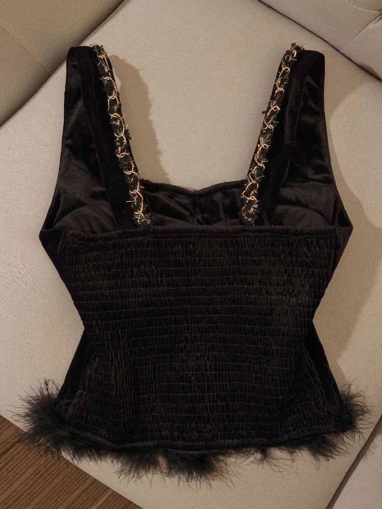 Black velvet and fur-trimmed camisole, versatile, elegant, and sophisticated, perfect for layering or wearing on its own.