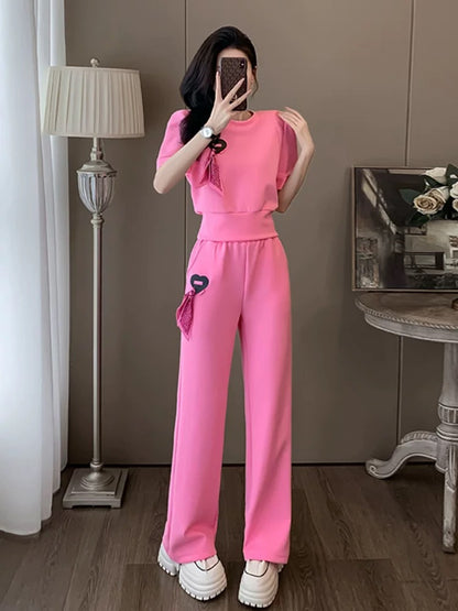 Pink internet celebrity sports and leisure suit for women, summer fashion, slim and beautiful, fashionable street short-sleeved wide-leg pants two-piece set