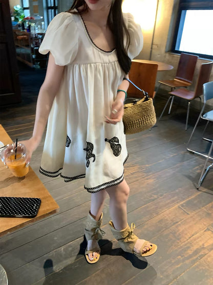Jennie-style dress: An exquisite, high-quality Lyocell piece featuring delicate lace embroidery and a soft, feminine babydoll silhouette—perfect for summer.