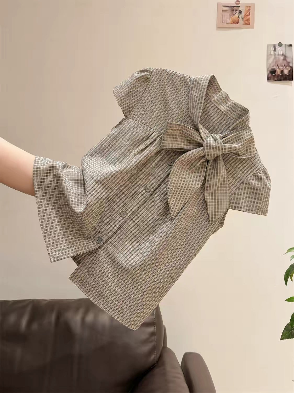 Unisex retro plaid short-sleeve top featuring a mandarin collar, bow-tie detail, and flattering flutter sleeves—perfect for a chic, intellectual summer look.