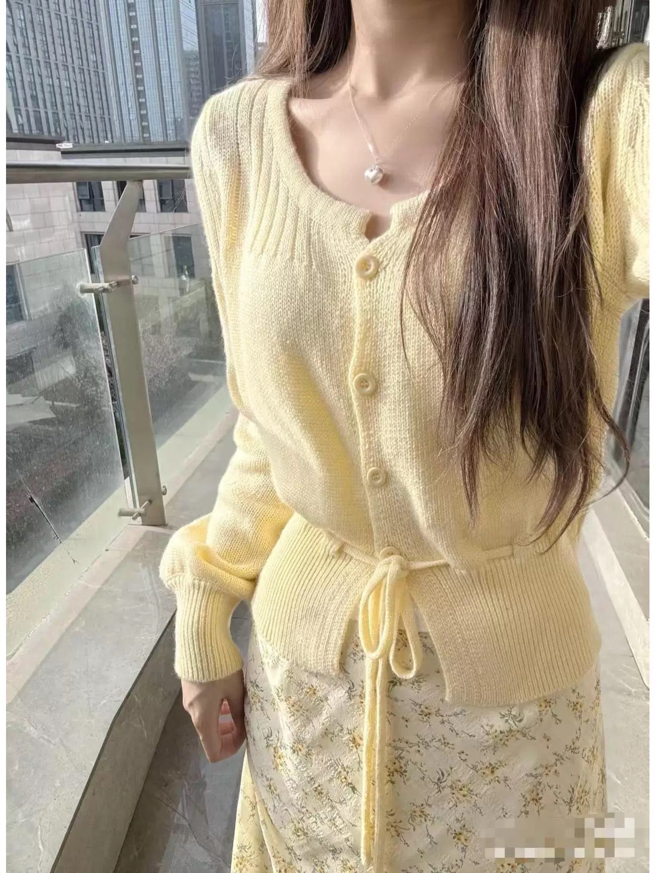Korean style early autumn gentle style yellow knitted cardigan floral skirt suit female high-end temperament a complete set of wear