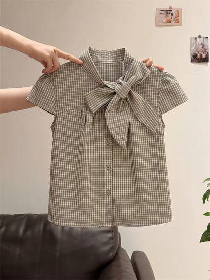 Unisex retro plaid short-sleeve top featuring a mandarin collar, bow-tie detail, and flattering flutter sleeves—perfect for a chic, intellectual summer look.