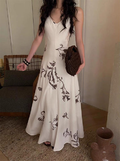 New Arrival: French-style elegant Tencel printed camisole dress with a waist-cinching design.