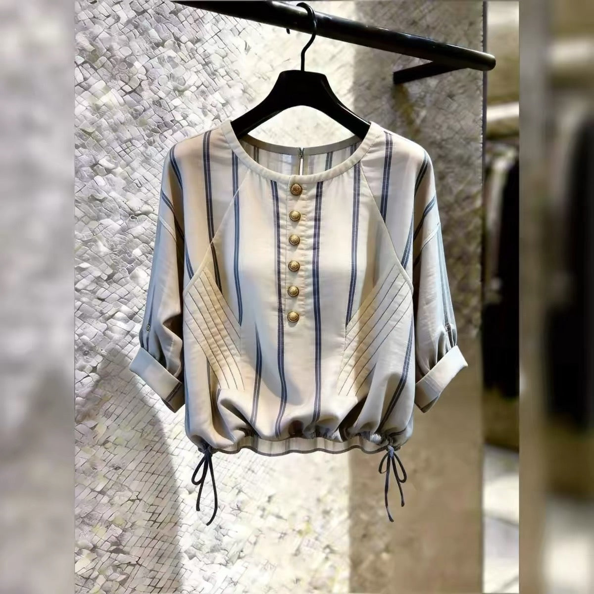 Store-exclusive 2026 Summer New Arrival: Women's French-style striped top featuring a round neck, chic commuter aesthetic, and a drawstring waist.