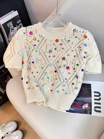Korean-style "affordable luxury" knit top for women: a soft, relaxed-fit summer tee featuring an openwork round neck and intricate 3D sequin embellishments—perfect for an "Insta-worthy" look.