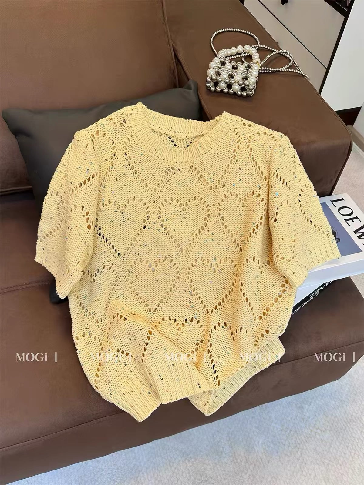 Stylish yellow knit top for women featuring a trendy cut-out design; a chic, loose-fitting, and versatile short-sleeve T-shirt—new for summer.