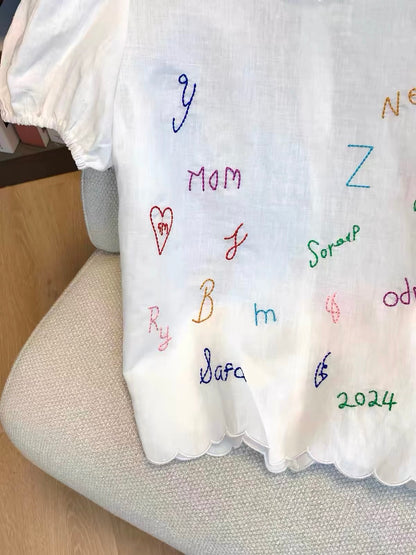 Women's Japanese-style linen-blend short T-shirt featuring playful letter embroidery; a unique, casual, and versatile design that offers a youthful look—perfect for summer.