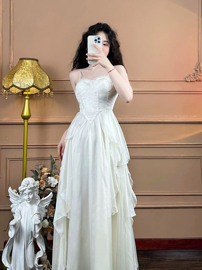Mrs. Xiao's white French suspender dress for women's pure desire tea break slimming irregular seaside vacation fairy dress summer