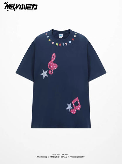 Unisex loose-fit short-sleeve T-shirt featuring a musical note and star appliqué; a versatile, casual crew-neck top with a unique, distinctive design.