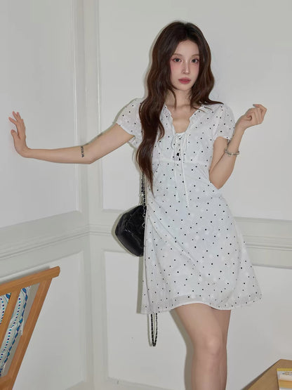 Chaochao French-style white polka-dot V-neck short-sleeve dress—a casual, slim-fit A-line mini dress for women (Summer 2026) designed to flatter the hips.