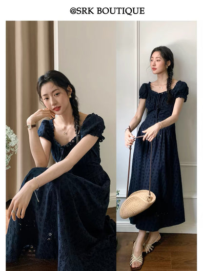 SRK French-style vintage navy blue A-line maxi dress featuring a stylish square neckline, intricate cut-out embroidery, and a flattering, voluminous skirt.