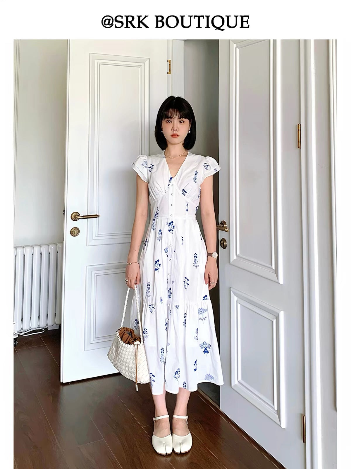 SRK French-style embroidered white dress featuring delicate flutter sleeves, a slimming V-neck, and a waist-defining fit—an elegant, ethereal, and unique piece.
