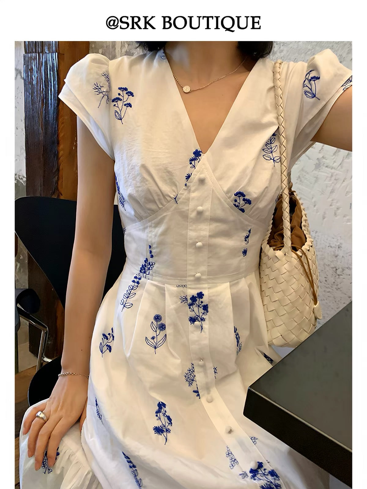 SRK French-style embroidered white dress featuring delicate flutter sleeves, a slimming V-neck, and a waist-defining fit—an elegant, ethereal, and unique piece.