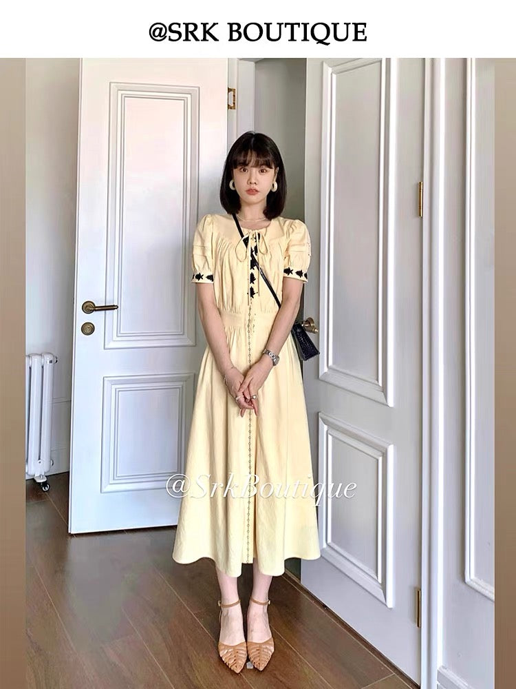 SRK French-style fresh and chic pale yellow linen maxi dress featuring embroidery, a high-waisted design, and a side slit for a slimming silhouette.