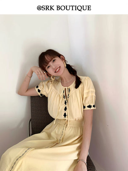 SRK French-style fresh and chic pale yellow linen maxi dress featuring embroidery, a high-waisted design, and a side slit for a slimming silhouette.