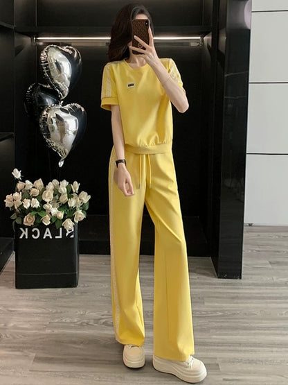 High-end pink casual sports suit for women 2025 summer trendy age-reducing slimming short-sleeved T-shirt wide-leg pants two-piece suit